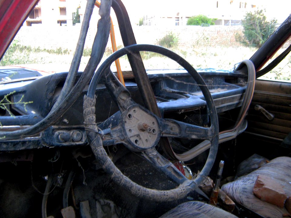 Destroyed red car in a abandoned zone nearnear amin eslami garden- Nishapur 3