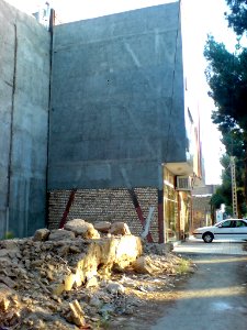 Desroyed wall of an old house - new building - Kashmar 2