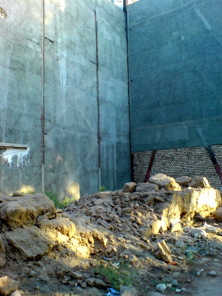 Desroyed wall of an old house - new building - Kashmar 1