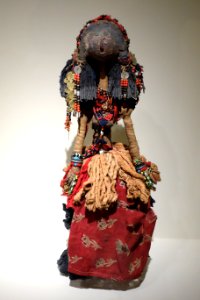 Doll, Omcurman region, Sudan, possibly Baggara peoples, late 19th or early 20th century, wood, mud, resin, cloth, yarns, glass beads, coins, buttons, bells, metal, coral - Cincinnati Art Museum - DSC04259