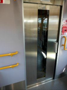 Door between carriages on JR West M322-4