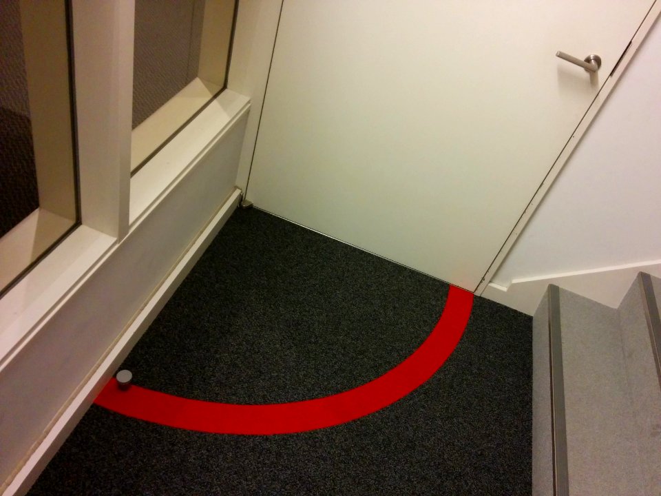 Door area marking on the floor in emergency evacuation stairs