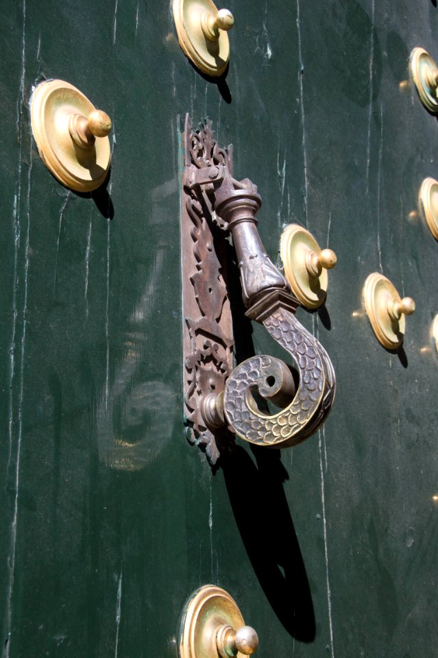 Door knocker main portal monastery El Escorial Spain
