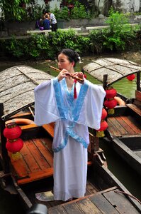 Chinese woman chinese woman with flute chinese woman on boat
