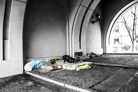 Poverty under a bridge stone floor photo