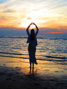 Colorful sunset girl gesture photo