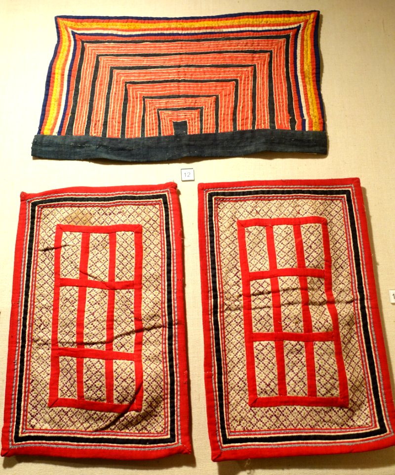 Embroideries and mosaic fabric on garment collars and shoulders, Mong, Lao Cai, Ha Giang, and Lai Chau provinces - Vietnam National Museum of Fine Arts - Hanoi, Vietnam - DSC05194