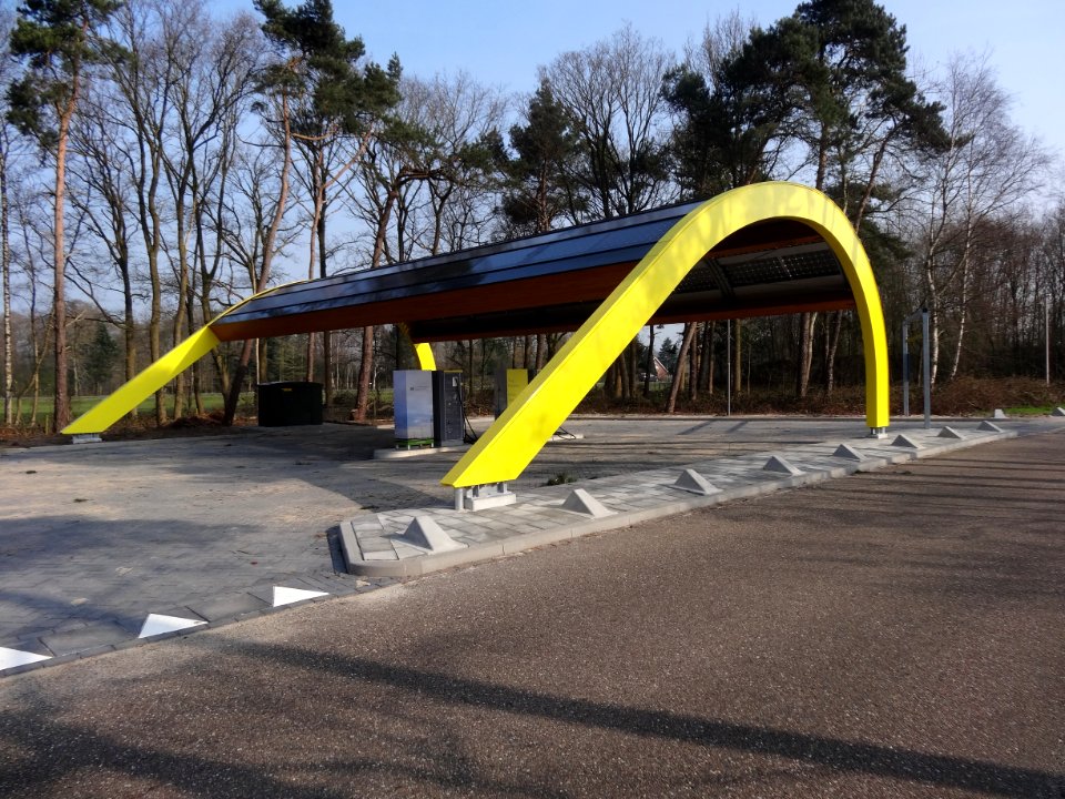 Electric vehicle charging stations at motorway station on highway in the Netherlands 1