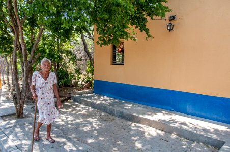 Elderly woman walking by Tuey 2