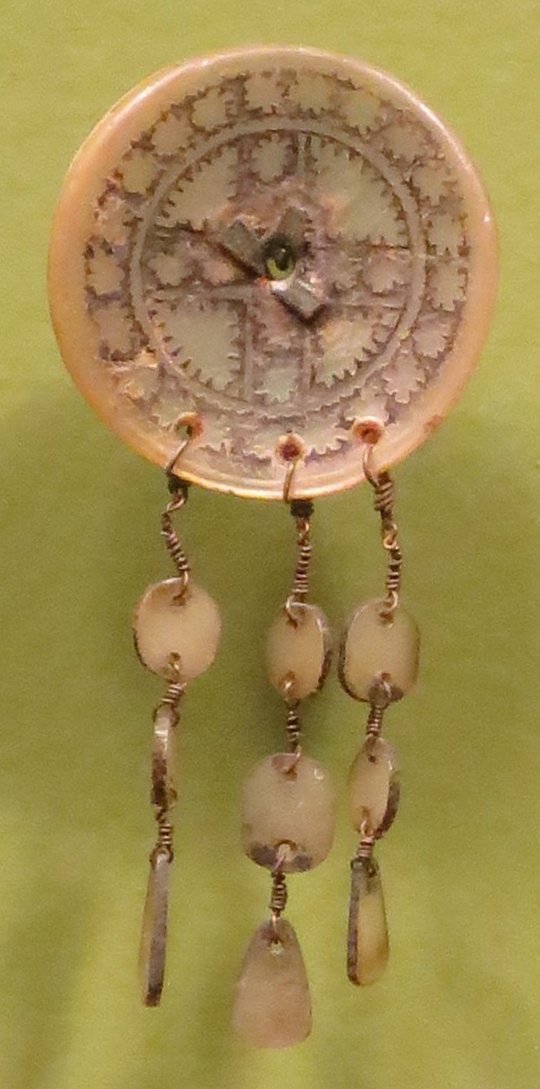 Earring from Ilongot in northern Luzon, Honolulu Museum of Art 8375.1