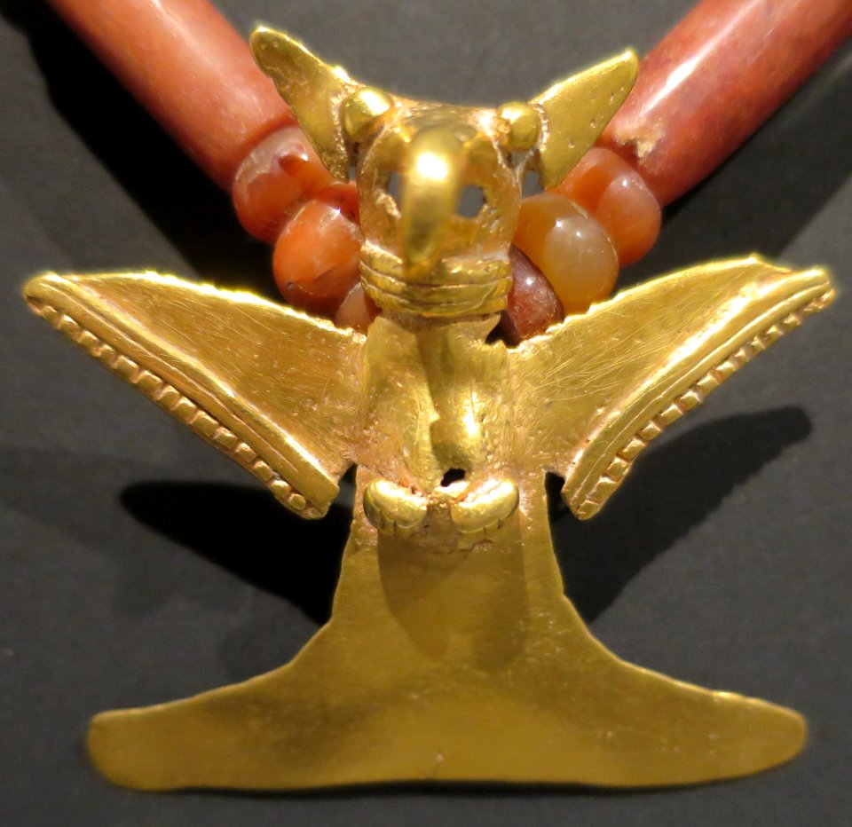 Eagle pendant mounted on a Tairona carrion effigy necklace, Dayton Art Institute