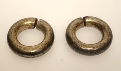 Earrings given to Ke Ve by her parents-in-law, Ta Oi, A Luoi, Thua Thien Hue, 1956, silver - Vietnamese Women's Museum - Hanoi, Vietnam - DSC04393