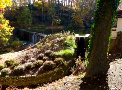 Echo Lake park NJ with dam and waterwheel in early autumn