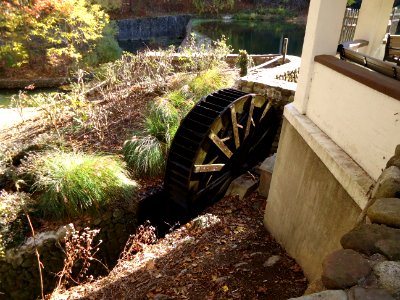 Echo Lake park in NJ with waterwheel turning and dam in background photo