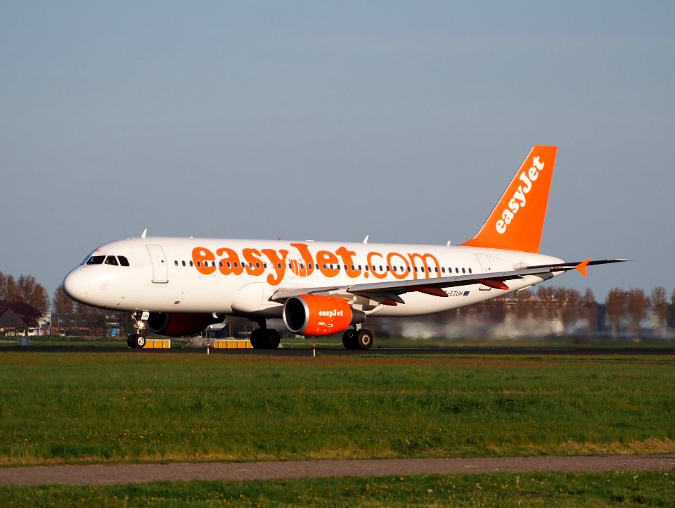 Easyjet Airbus 320 G-EZUH takeoff from Polderbaan, Schiphol (AMS - EHAM) at sunset, pic1