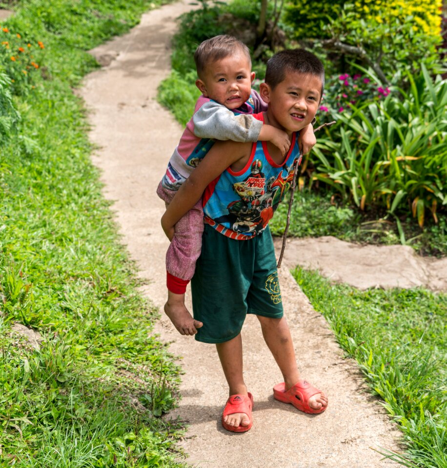 Boys carrying baby path