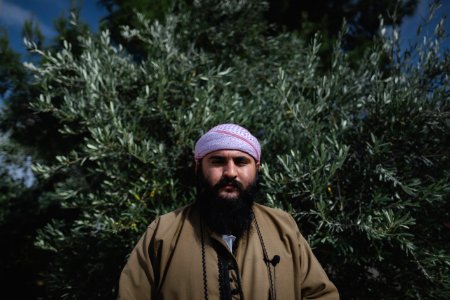 Ezidi religious leader Mam Fakher in June of 2019 in Shingal, performing a pray toward the sunlight 03