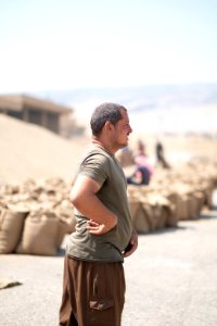 Ezidi workers and administrators packing grain in summer of 2019 at the grain processing center in Shingal 34