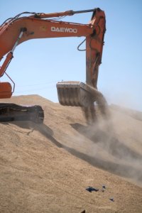 Ezidi workers and administrators packing grain in summer of 2019 at the grain processing center in Shingal 24