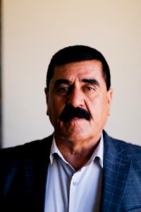 Ezidi Mayor Fahad Hamid of Shingal in summer of 2019 in his office, discussing the fires plaguing the district 07