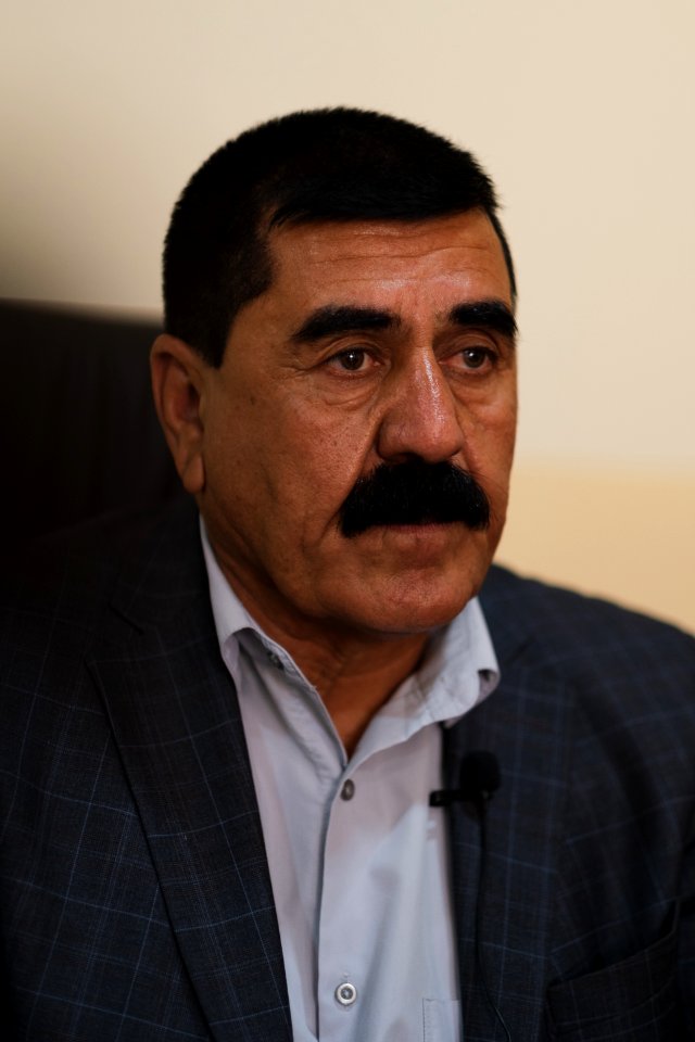 Ezidi Mayor Fahad Hamid of Shingal in summer of 2019 in his office, discussing the fires plaguing the district 01
