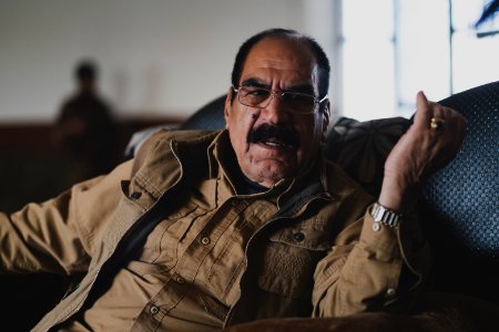 Ezidi Peshmerga commander Qasim Shesho giving an interview at his base in the Sinjar Mountains 15