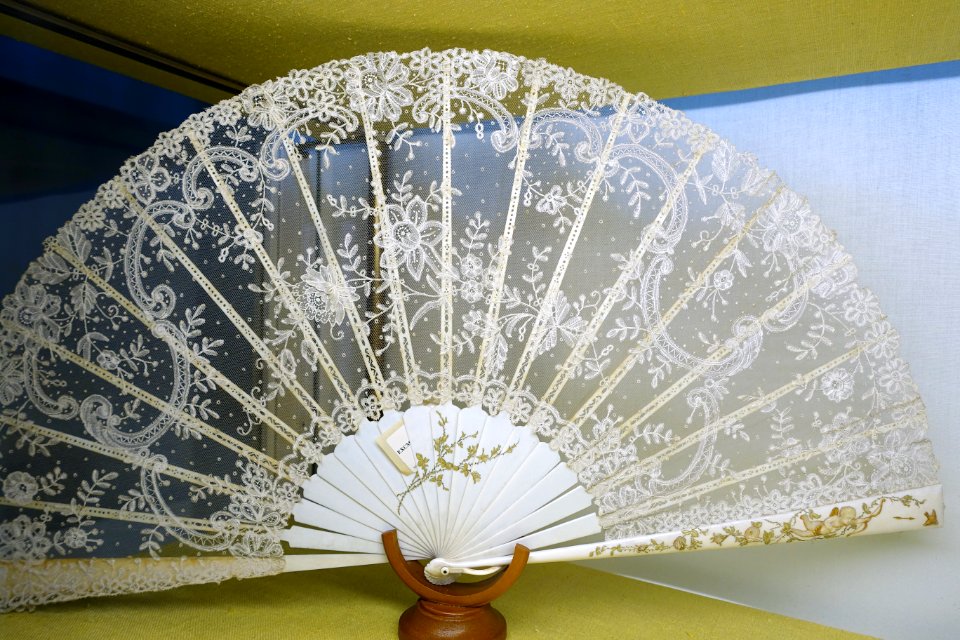 Fan, Europe, 19th century, painted ivory with Cupid on the frame, Chantilly lace - Fan Room, Alcázar of Seville, Spain - DSC07331