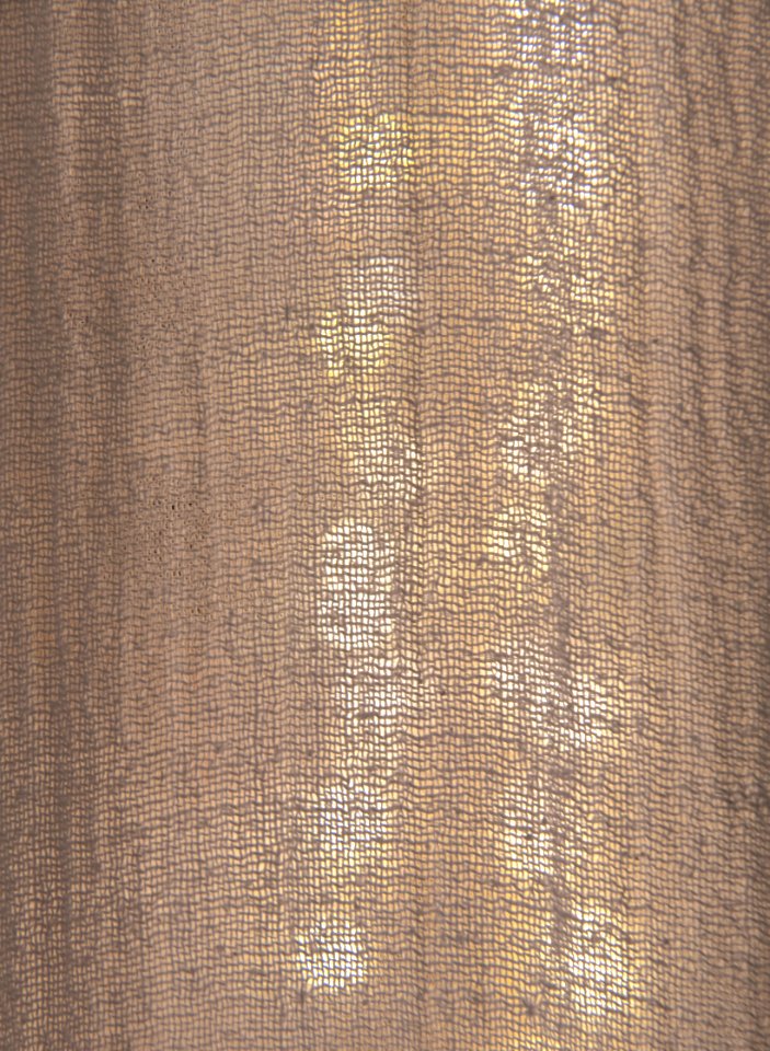 Fairy lights behind a curtain