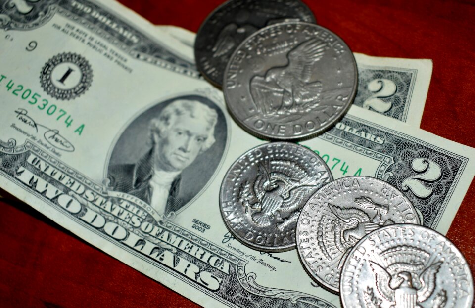 Two dollar bill half dollar dollar coin