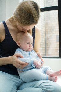 Caucasian boy holding photo