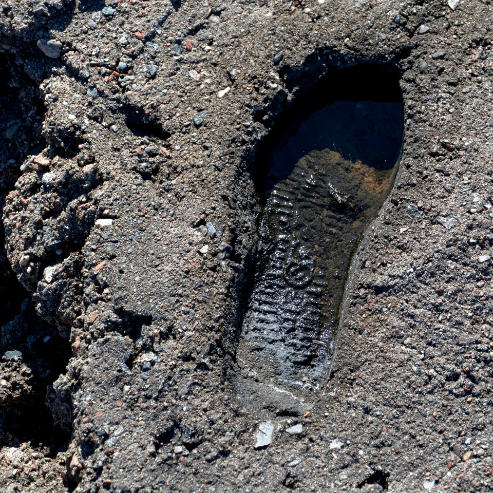 Footprint in concrete on the old Govik quay