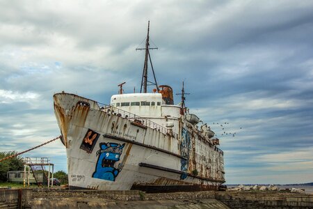 Dilapidated boat abandoned sea