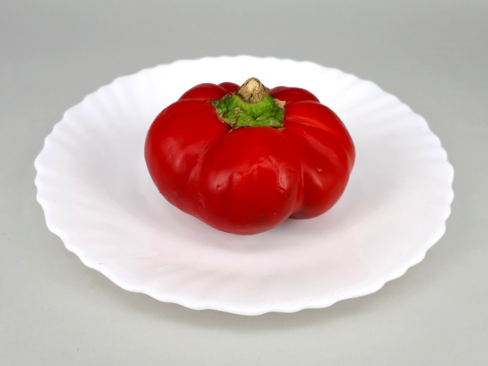 Flat bell pepper on a plate 2017 A