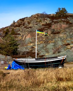 Flagpole and small boat in Loddebo photo