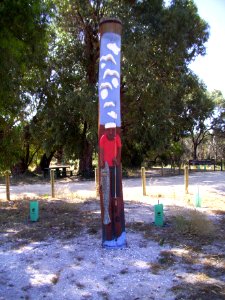 Fisherman carved heritage pole at Preston Beach town entrance (E37@WTW2013)