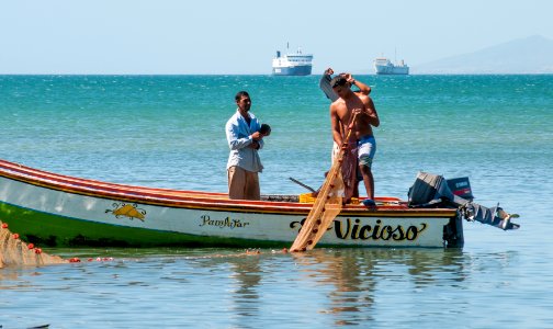 Fishermen returning from slaughter photo