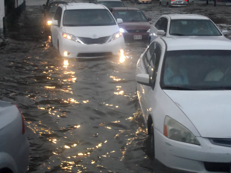 Flooded street and vehicles