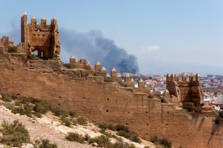 Fortification, fire in background, Almeria, Spain photo