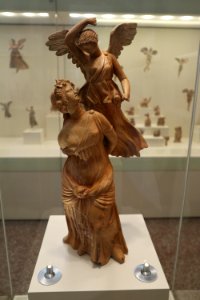 Female figure and Nike playing (3). 2nd cent. B.C
