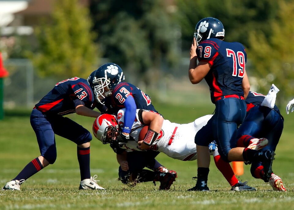 Defense tacklers teamwork