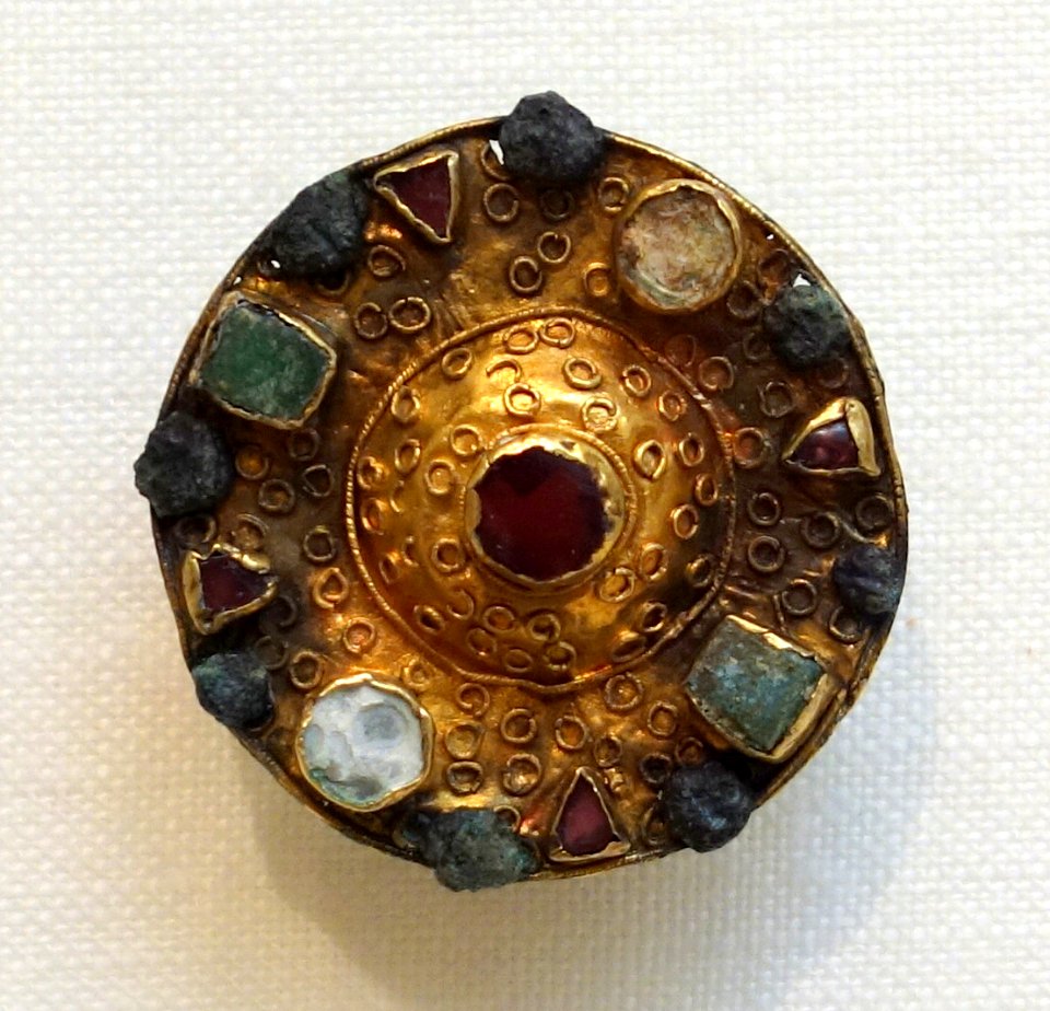 Filigree Bossed Disk Brooch, Frankish, 7th century, Niederbreisig, Rheinland Pfalz, bronze with gold overlay, mother of pearl, garnets, green glass, lent by Met. Museum of Art - Chazen Museum of Art - DSC01935