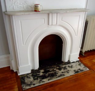 Fireplace repaired after left side being glued then painted with molding added