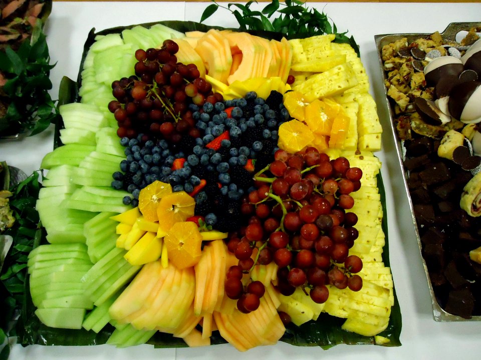 Fruit tray including pineapple honeydew melon oranges grapes