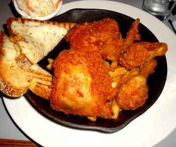 Fried chicken served at a restaurant with french fries