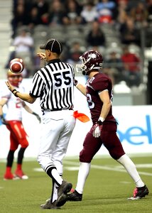 Football referee bobbling ball toss photo