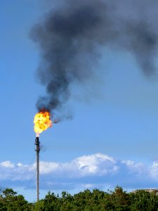 Gas flare on top of a flare stack at Preemraff Lysekil 1 photo