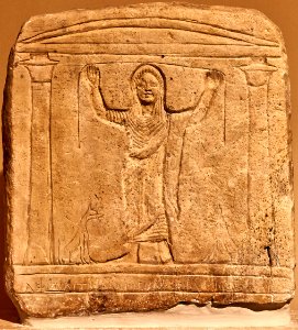 Funerary stele with a praying female figure flanked by two jackals at the Byzantine and Christian Museum on 12 April 2019
