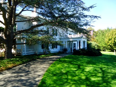 Frelinghuysen Arboretum with tree and house and lawn photo