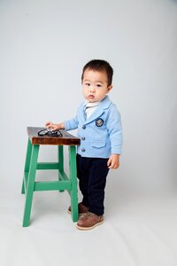 Small dudes boy boy with stool