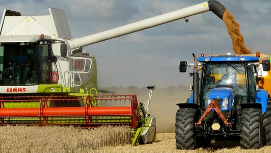 Arable farming harvest time agricultural vehicles photo